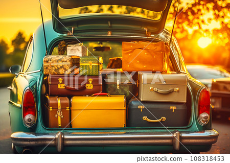 Retro car with luggage in trunk at sunset 108318453