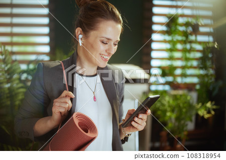 happy modern business woman in modern green office happy modern business woman in modern green office 108318954