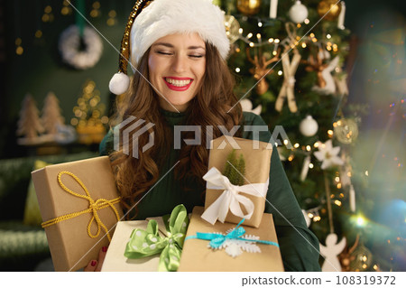 happy stylish woman in green dress at modern home 108319372