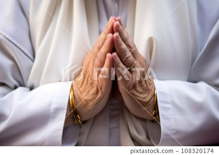 close-up of nuns hands clasped in prayer 108320174