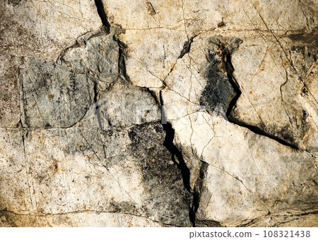 detail of cracks in cream-colored limestone detail of cracks in cream-colored limestone 108321438