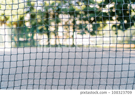Tennis net stretched on the court in the park 108323709