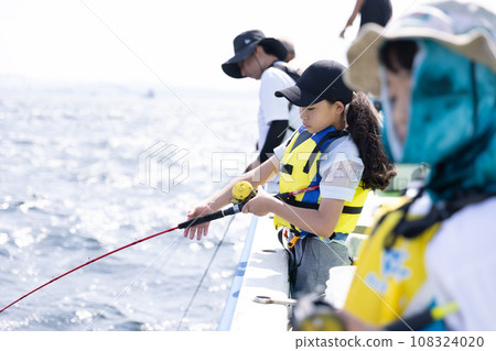 Girl enjoying fishing 108324020