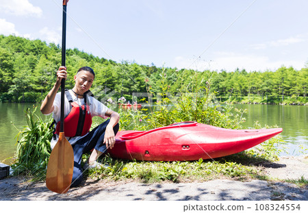 man enjoying kayaking 108324554