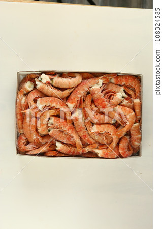 frosted king prawns closeup photo on white table background  108324585