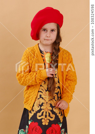 little model girl in designer dress, red hat and military closeup photo little model girl in designer dress, red hat and military closeup photo 108324598