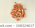 frosted king prawns closeup photo on white table background  108324617