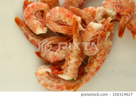 frosted king prawns closeup photo on white table background  108324627