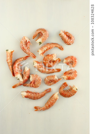 frosted king prawns closeup photo on white table background  108324628