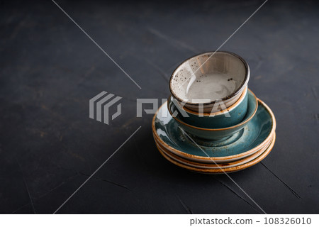 Stack of plates and bowls 108326010