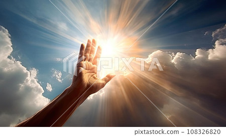 A man's hand reaches for the light in the clouds 108326820