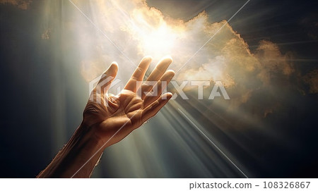 A man's hand reaches for the light in the clouds 108326867
