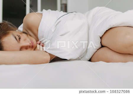 Woman sleeping and wake up late in very comfort morning. 108327086