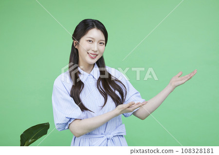 Green consumer_Image of a korean asain beautiful woman with hands gesturing to introduce herself 108328181