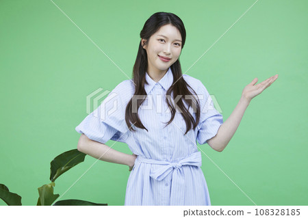 Green consumer_Image of a korean asain beautiful woman with hands gesturing to introduce herself 108328185