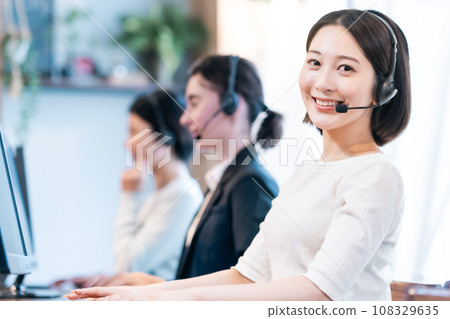 Young woman working in a call center Young woman working in a call center 108329635