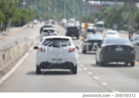highway traffic with safety barrier on road asphalt, blurred image 108330372