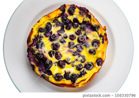 Top view of freshly baked homemade yogurt blueberry cake in white ceramic dish. Top view of freshly baked homemade yogurt blueberry cake in white ceramic dish. 108330796