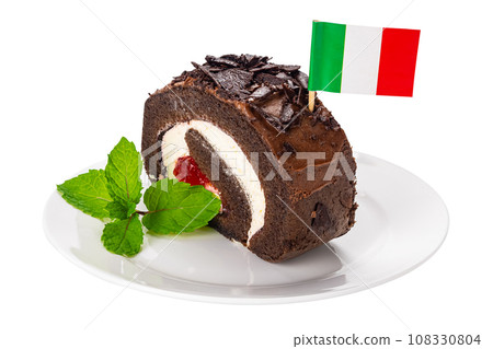 Slice of delicious homemade chocolate roll cake with Italian flag cocktail pick. Slice of delicious homemade chocolate roll cake with Italian flag cocktail pick. 108330804