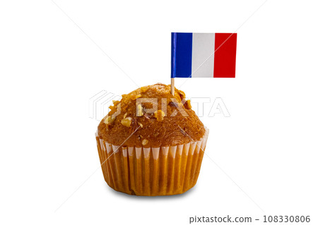 Delicious homemade cupcake with small paper flag of france bamboo cocktail pick. Delicious homemade cupcake with small paper flag of france bamboo cocktail pick. 108330806