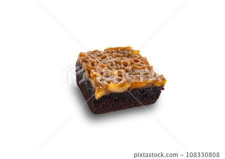 High angle view of delicious homemade chocolate toffee cake topping with cashew nut and caramel. 108330808