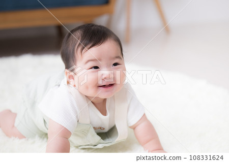 A plump and chewy baby with a precious and happy smile A plump and chewy baby with a precious and happy smile 108331624