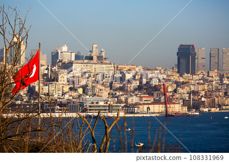 Turkish flag and Istanbul cityscape across Bosphorus Turkish flag and Istanbul cityscape across Bosphorus 108331969