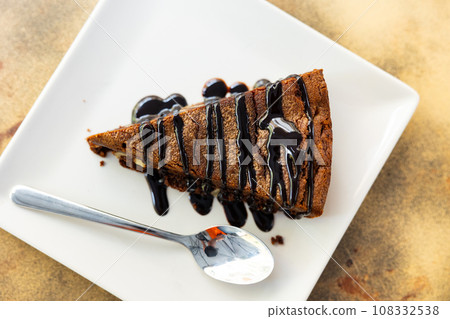 Piece of brawny with walnuts served in a plate 108332538