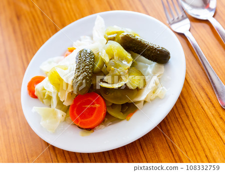 Turkish pickles made with cucumber, cabbage and carrots closeup 108332759