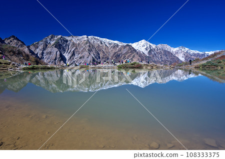 Beautiful Happo Pond reflecting the Hakuba Mountain Range 108333375