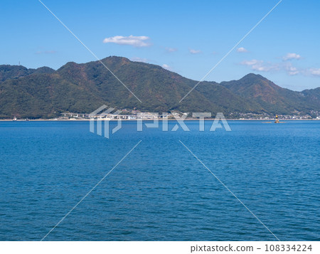 View of the Seto Inland Sea and Honshu from the coast of Saki Island (Mihara City, Hiroshima Prefecture). View of the Seto Inland Sea and Honshu from the coast of Saki Island (Mihara City, Hiroshima Prefecture). 108334224