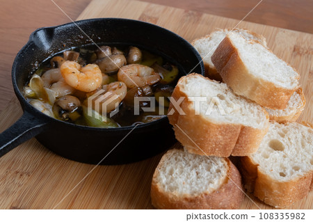 Ajillo bread baguette Ajillo bread baguette 108335982