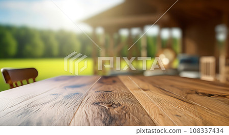 wooden table top, against the background of a wooden gazebo, outside the city, in summer 108337434