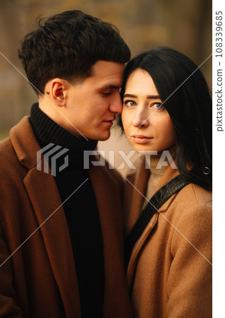Young couple in love walking in the park on a autumn day. Enjoying time together. 108339685