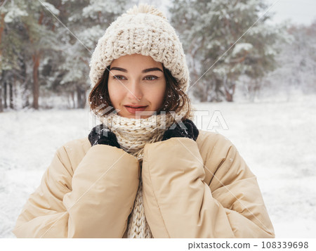 Contemplation of Winter Girl During Snowing Frosty Day in Snowy Forest  108339698