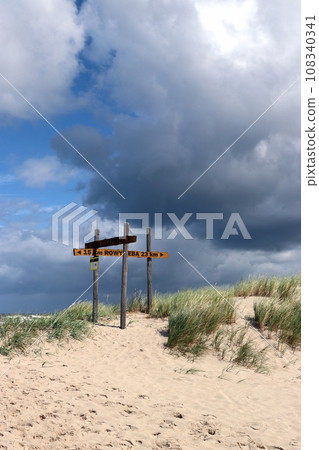 Crossroad on the tourist trail through the dunes near Czolpino village 108340341