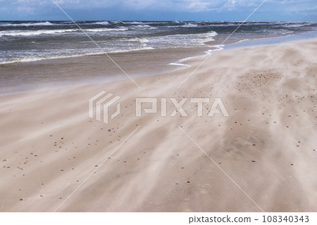 Sand blown by the wind on the coast of the Baltic Sea 108340343