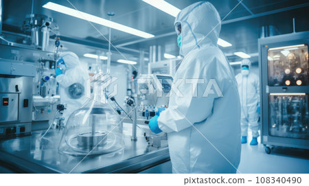 Scientists in Hazmat Sterile Suits in Technologically Advanced Laboratory Scientists in Hazmat Sterile Suits in Technologically Advanced Laboratory 108340490