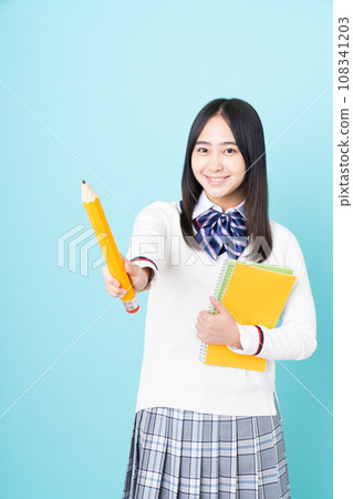 High school girl with pencil and notebook 108341203