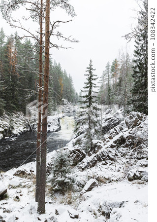 Kivach Falls landscape on a winter day. Vertical photo 108342422