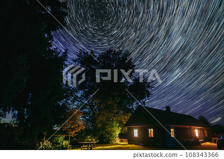 5k . Dramatic Twilight Sky Spin Trails Of Stars On Night Sky Ba 108343366