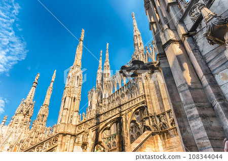 Spiers and statues on the gothic Cathedral of Milan, Italy Spiers and statues on the gothic Cathedral of Milan, Italy 108344044