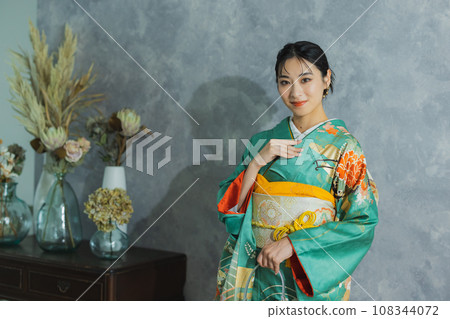 Woman in long-sleeved kimono Woman in long-sleeved kimono 108344072