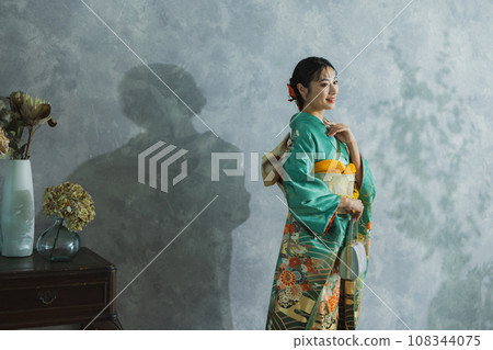 Woman in long-sleeved kimono Woman in long-sleeved kimono 108344075