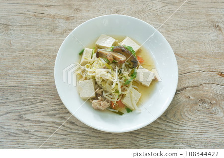 fried bean sprout with slice white tofu and carrot couple chop pork topping mushroom on plate fried bean sprout with slice white tofu and carrot couple chop pork topping mushroom on plate 108344422