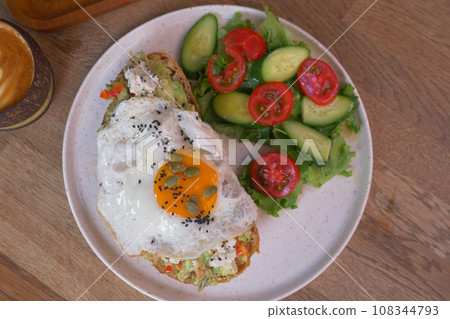 Tasty fresh toast with avocado and egg Tasty fresh toast with avocado and egg 108344793