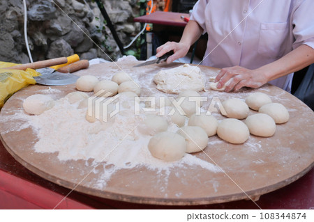 fresh raw dough for bread or pizza . fresh raw dough for bread or pizza . 108344874