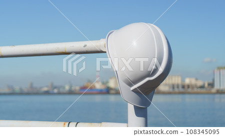 Helmet, sea and industrial area Helmet, sea and industrial area 108345095