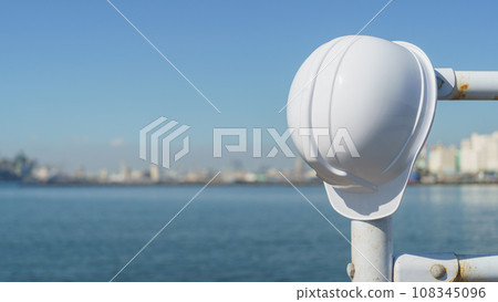 Helmet, sea and industrial area Helmet, sea and industrial area 108345096