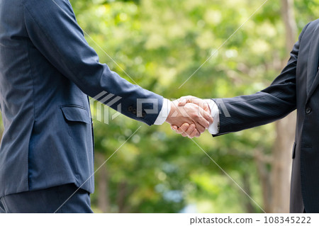 Business fresh green two men shaking hands 108345222